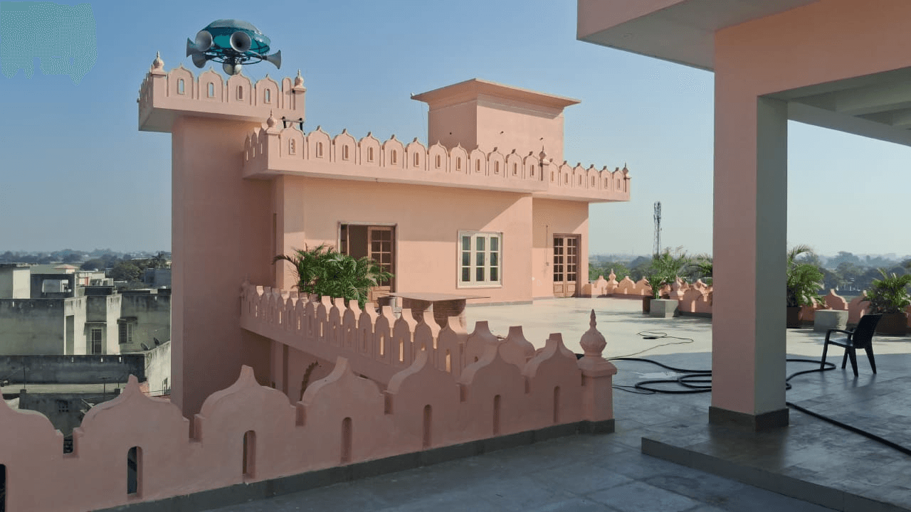Rooftop terrace with pink Rajasthani-style parapets